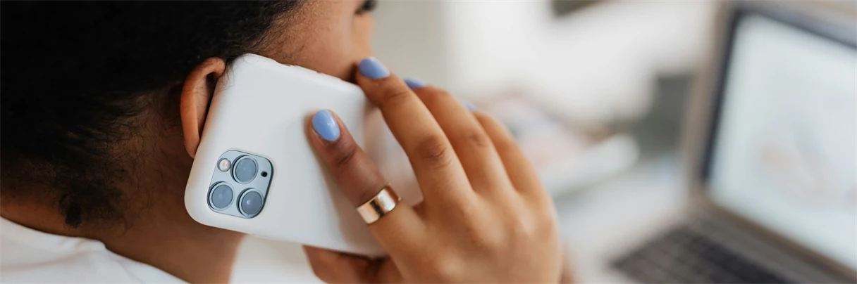 Woman in a phone call at desk