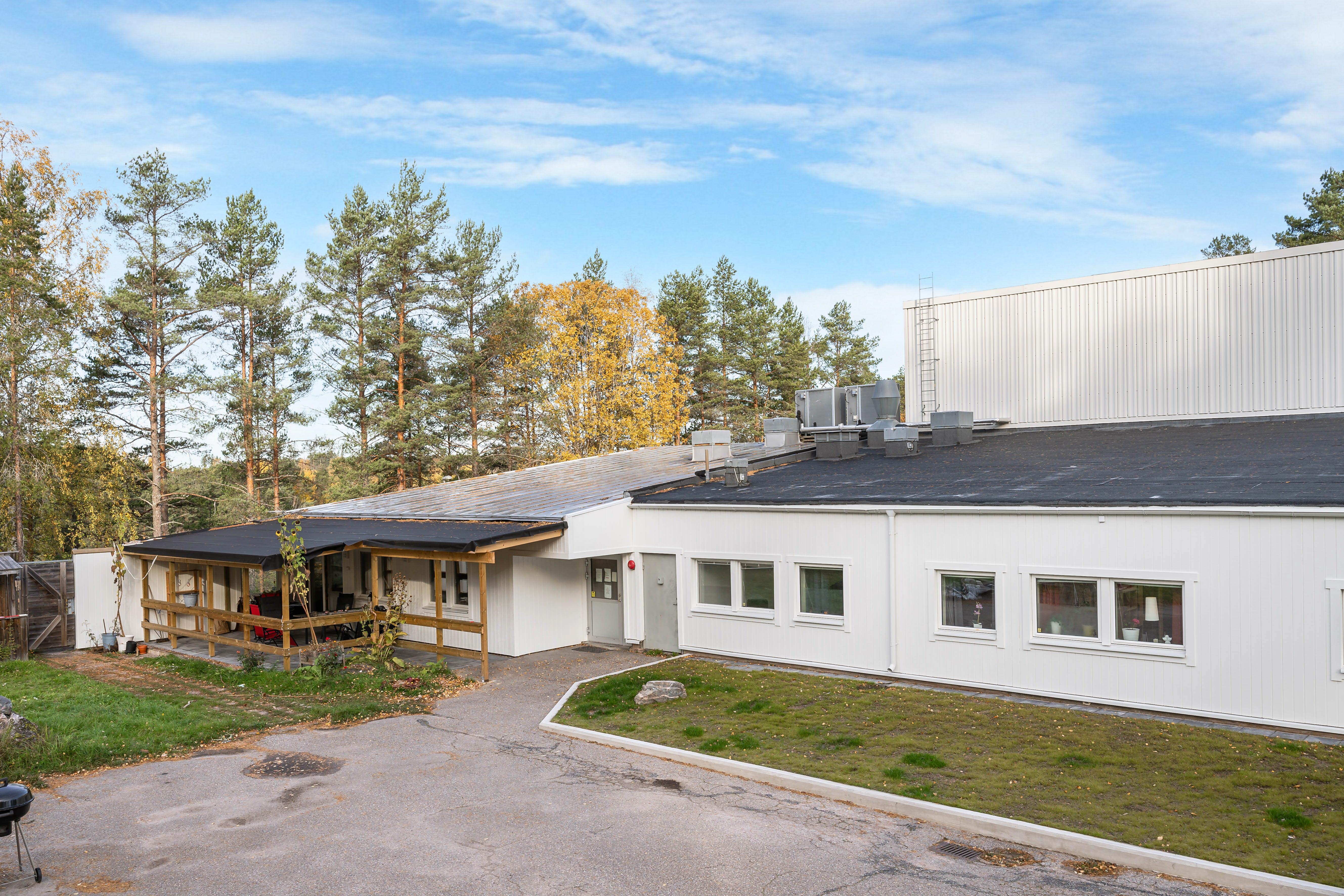 A house with trees in the background