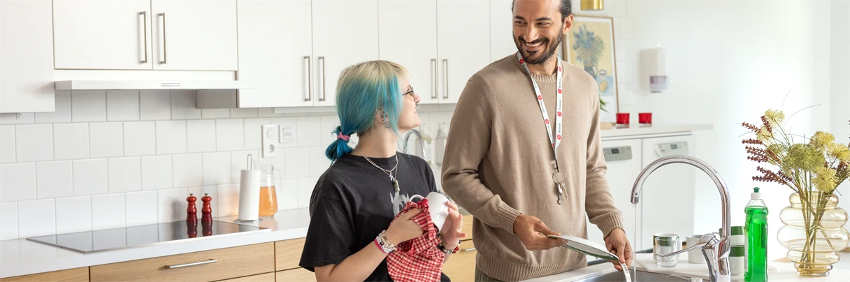 A person standing in a kitchen preparing food