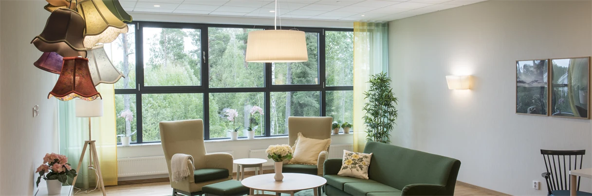 A living room filled with furniture and a large window