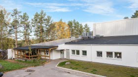 A house with trees in the background