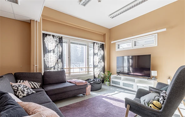 Room with orange walls and a couch
