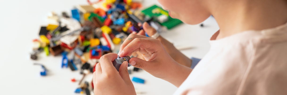 Child playing with lego
