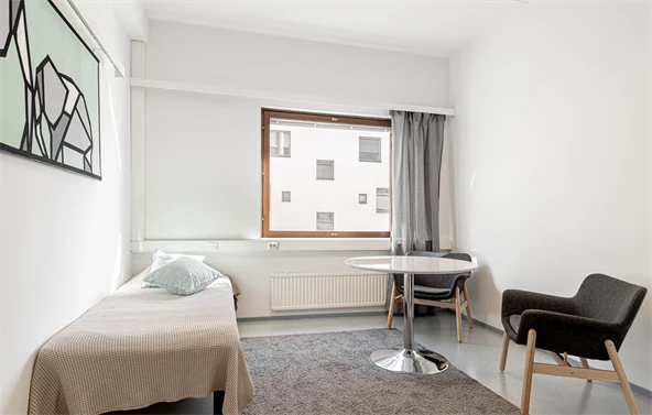 bedroom with bed and chair