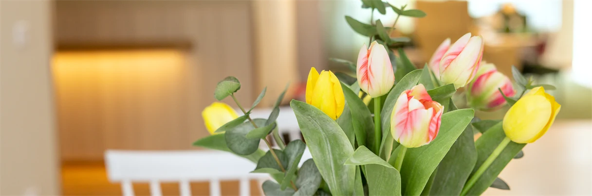 A vase filled with flowers sitting on a table