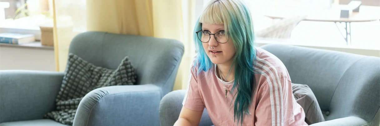 A woman sitting in a living room